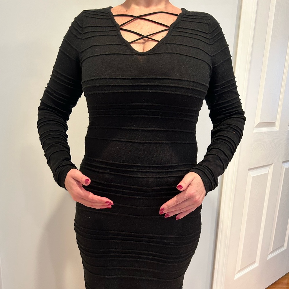 Knit black dress with front design size M length 41”